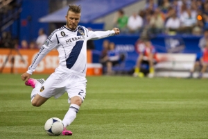 Los Angeles Galaxy's David Beckham scores a goal against the Montreal Impact during the second half of an MLS soccer match, Saturday, May 12, 2012, in Montreal. (AP Photo/The Canadian Press, Paul Chiasson)